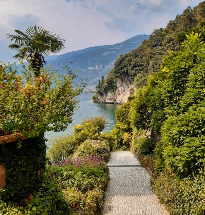 Crafting Captivating Headlines: Your awesome post title goes here Explore the lush pathway leading to the picturesque shores of Lake Como, Italy.